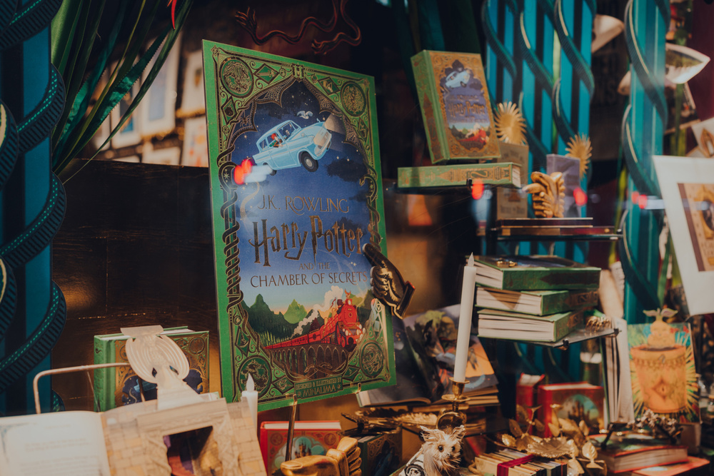 London, UK - November 23, 2021: Harry potter books in the window of MinaLima, the design studio behind the graphic props of the Harry Potter and Fantastic Beasts films, in Covent Garden, London