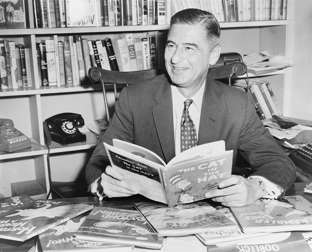 Dr. Seuss with one of his books, 1957